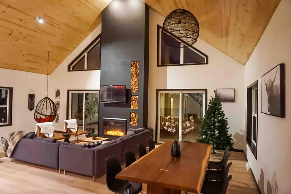 a living room filled with furniture and vase on a table